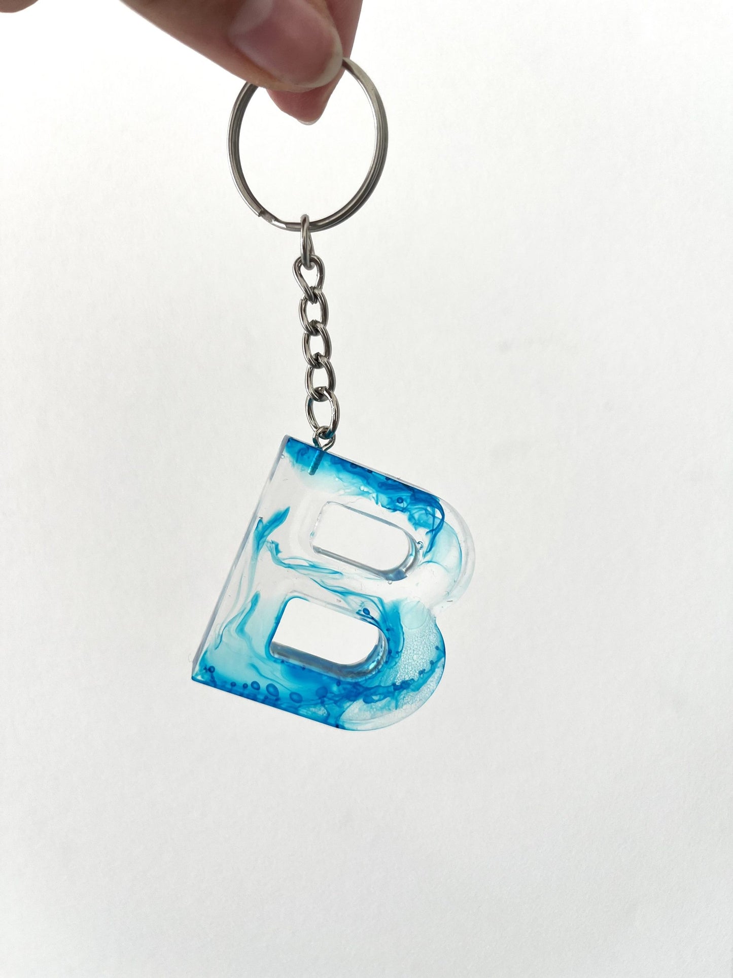 Porte clé lettre fumée bleu