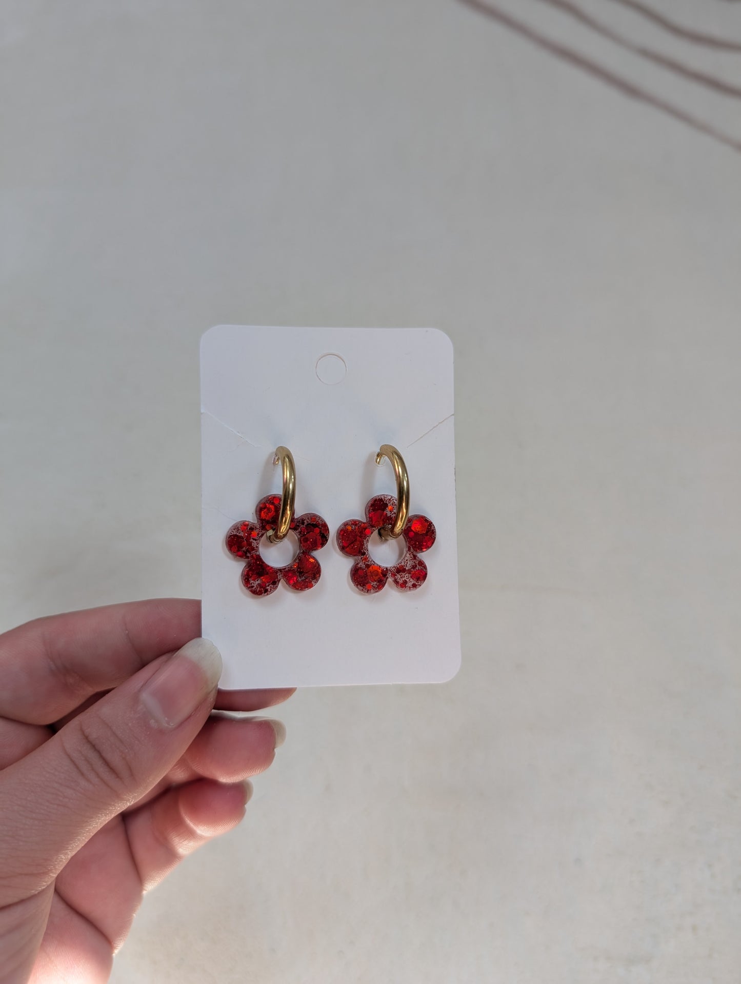 Pampille rouge à paillettes