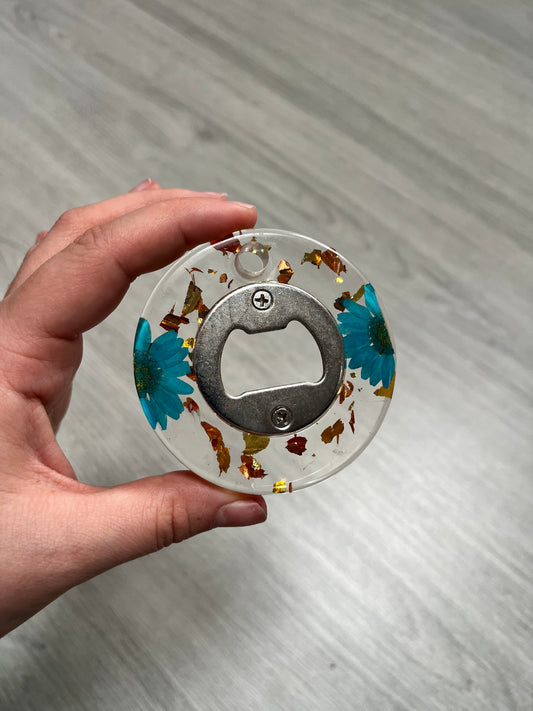 Décapsuleur rond fleur bleu